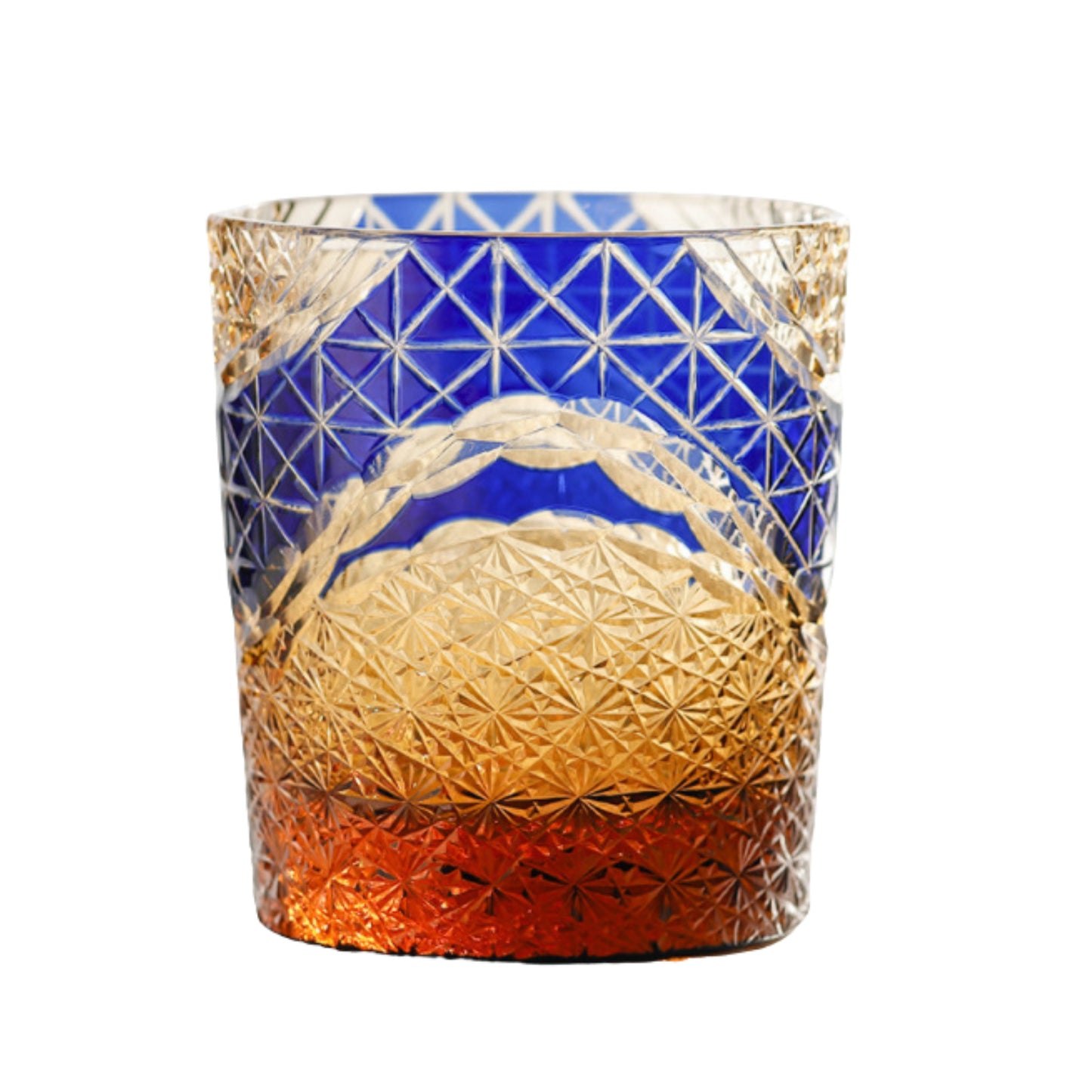 Blue Edo Kiriko whiskey glass with intricate geometric cuts and amber gradient.