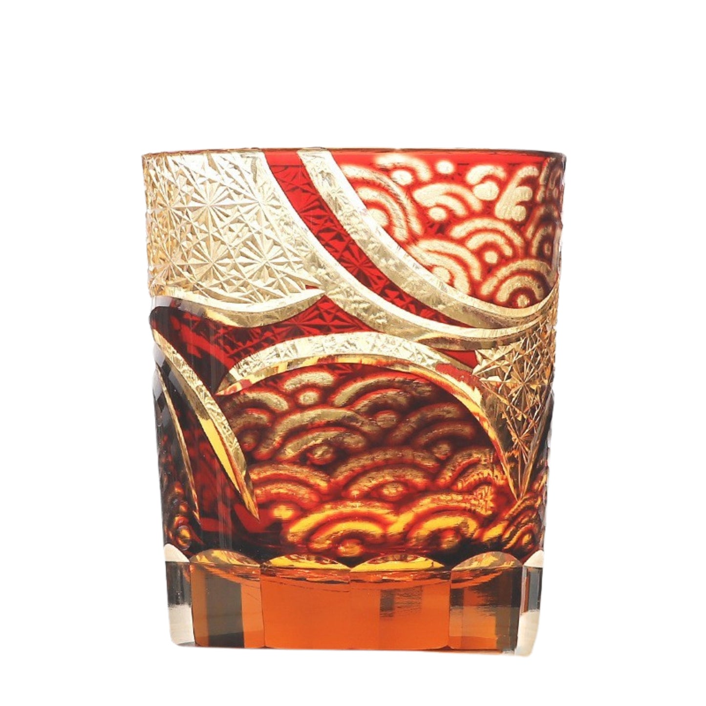 Red Edo Kiriko whiskey glass with intricate gold cut pattern on transparent base