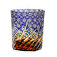 Edo Kiriko whiskey glass with blue and amber gradient, intricate star and wave engravings