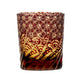 Edo Kiriko whiskey glass with red and amber body, detailed with traditional Japanese star pattern