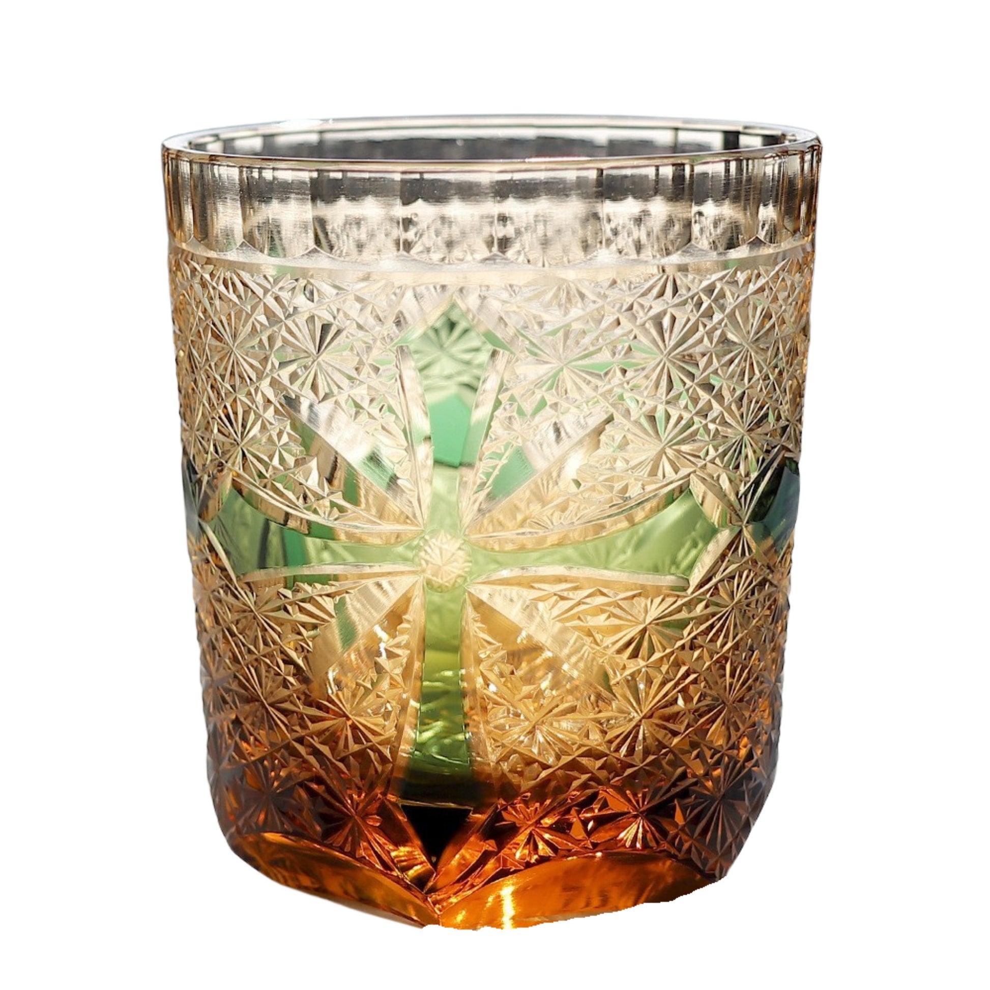 Edo Kiriko whiskey glass – green etched cross design over amber base with classic starburst carving.

