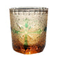 Edo Kiriko whiskey glass – green etched cross design over amber base with classic starburst carving.

