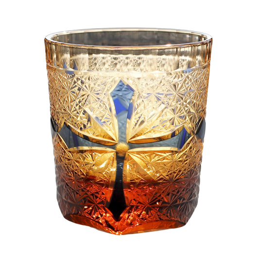 Edo Kiriko whiskey glass – deep blue crosscut with amber gradient and detailed star engraving.

