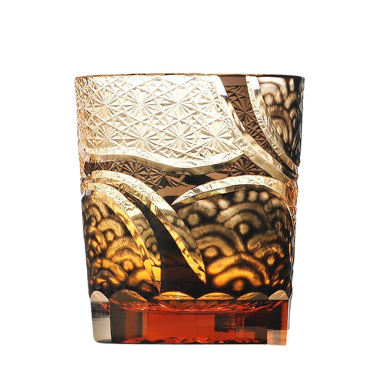Gold Edo Kiriko whiskey glass with engraved geometric motif and clear base

