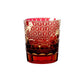 Red Edo Kiriko whiskey glass with intricate gold cut pattern on transparent base
